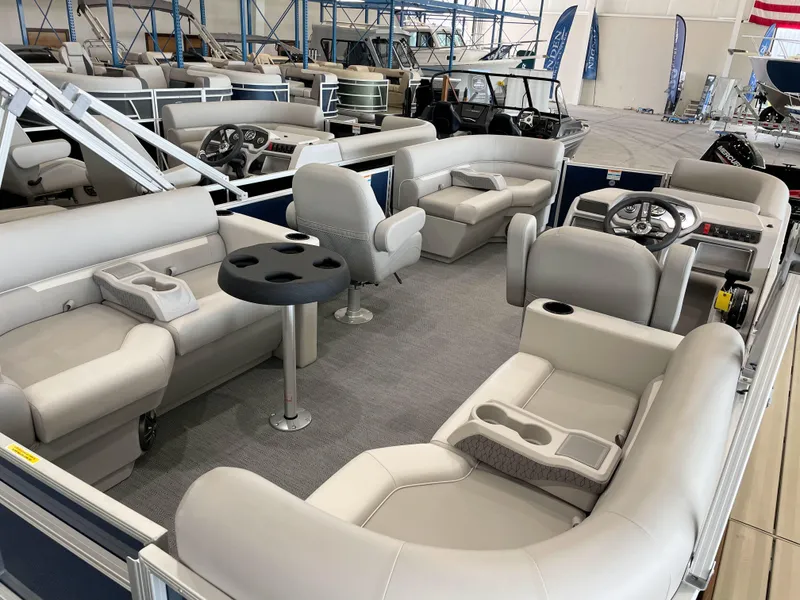 Slide: The Image of 2025 Godfrey EX2086SBX pontoon boat with spacious seating and modern interior design. - 16
