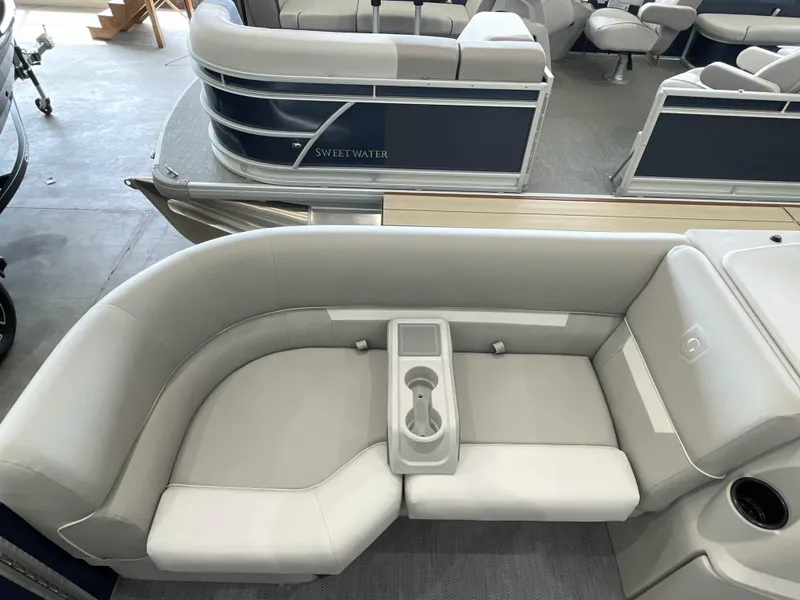 Slide: The Image of Luxurious seating on a 2025 Godfrey EX2086SBX pontoon boat with cup holders. - 3