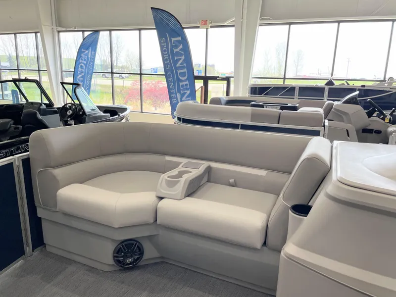 Slide: The Image of Luxurious seating on 2025 Godfrey EX2086SBX boat, showroom display with modern design. - 5