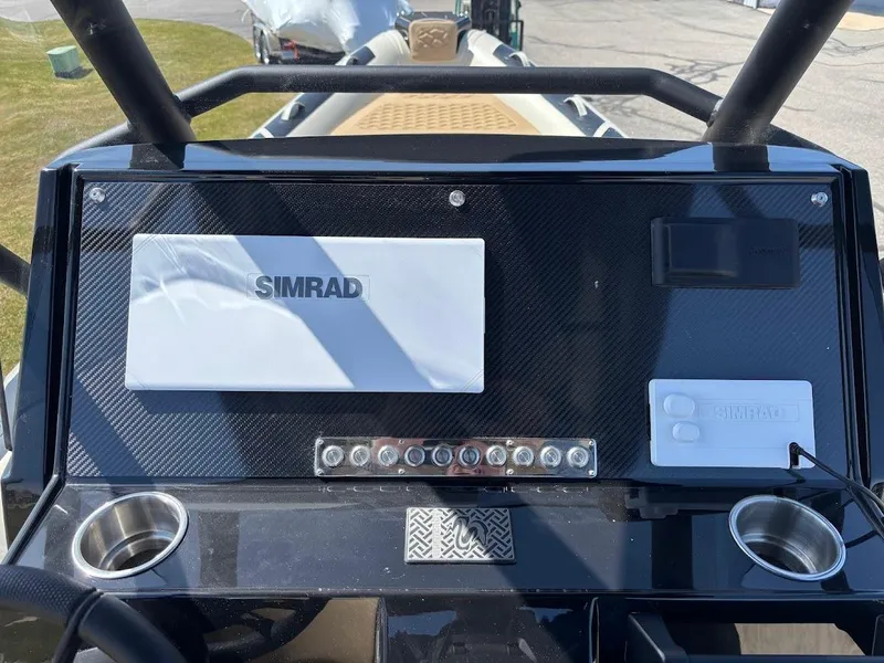 Slide: The Image of 2025 Highfield Sport 900 dashboard with Simrad navigation system and control panel. - 12