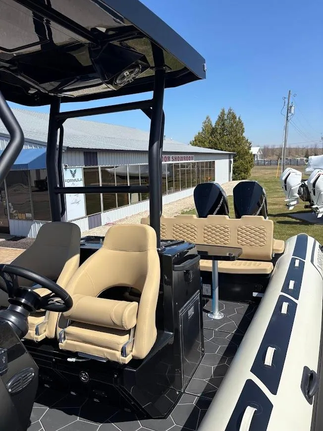 Slide: The Image of 2025 Highfield Sport 900 boat with beige seating and modern design. - 17