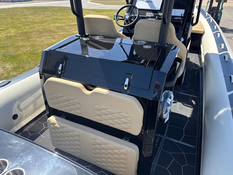 Slide: The Image of 2025 Highfield Sport 900 boat interior with sleek seating and modern console design. - 6