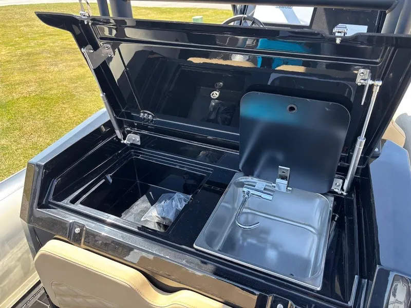 Slide: The Image of Open storage compartment on 2025 Highfield Sport 900 boat, featuring sleek design and utility. - 8