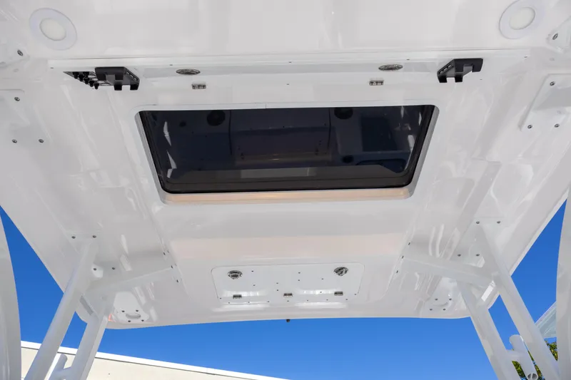 Slide: The Image of 2025 Sea Fox 268 Traveler boat roof with hatch, viewed from below against blue sky. - 15