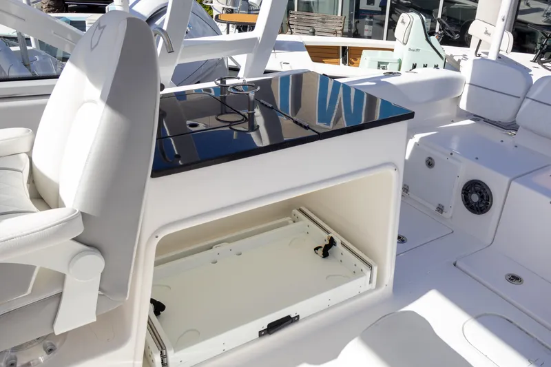 Slide: The Image of 2025 Sea Fox 268 Traveler boat interior with seating and storage compartment. - 16