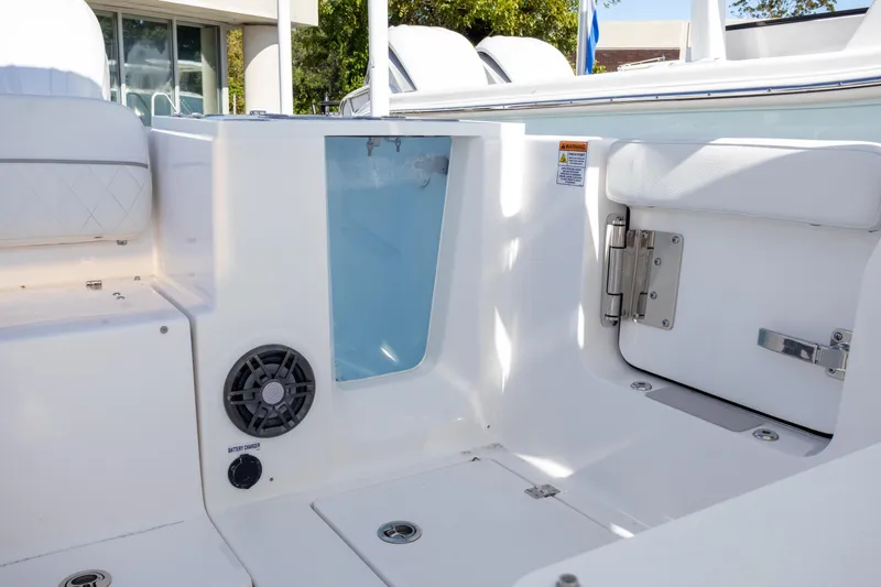 Slide: The Image of 2025 Sea Fox 268 Traveler boat interior with storage compartments and speaker. - 17