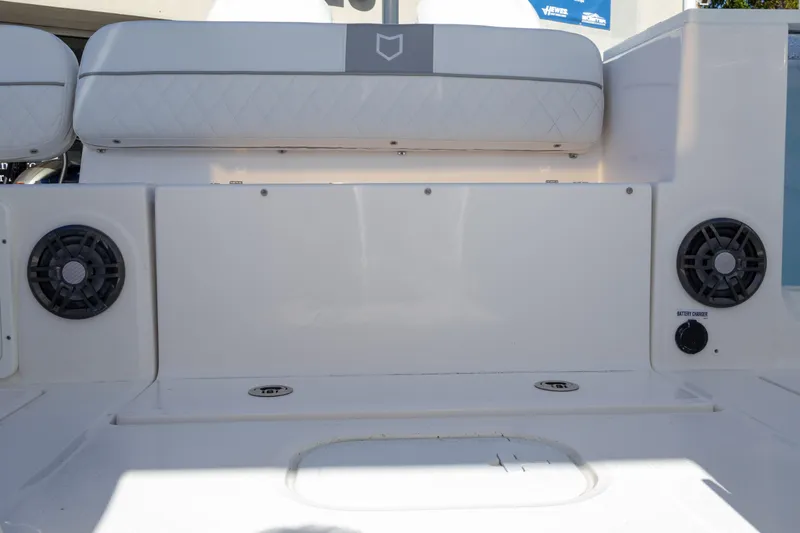Slide: The Image of 2025 Sea Fox 268 Traveler boat interior with speakers and cushioned seating. - 18