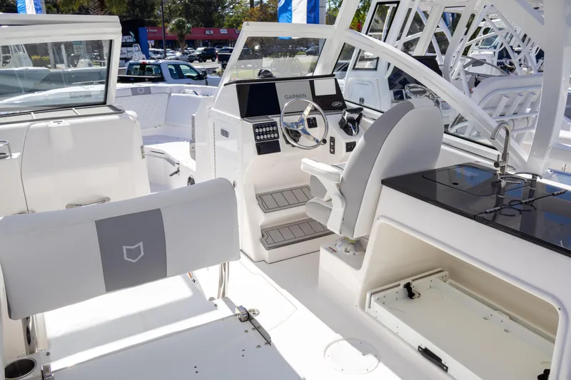 Slide: The Image of 2025 Sea Fox 268 Traveler boat interior with helm, seating, and modern controls. - 20