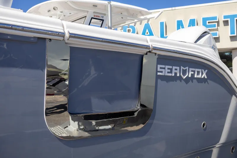 Slide: The Image of 2025 Sea Fox 268 Traveler boat exterior with logo, displayed at dealership. - 3