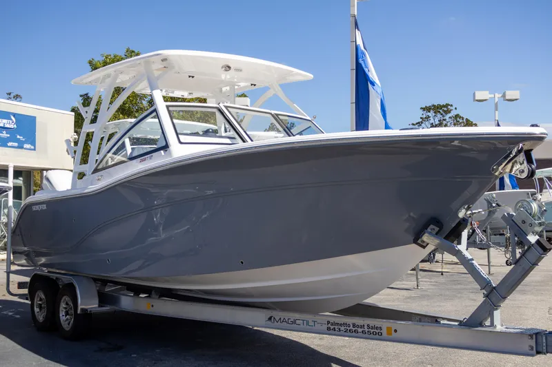 Slide: The Image of 2025 Sea Fox 268 Traveler boat on trailer, displayed outdoors. - 4