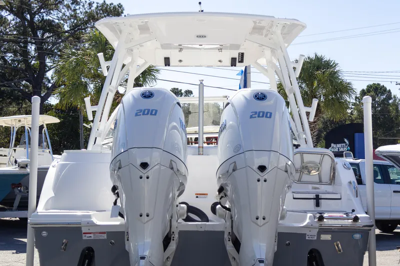 Slide: The Image of 2025 Sea Fox 268 Traveler boat with dual 200 horsepower engines, docked outdoors. - 5