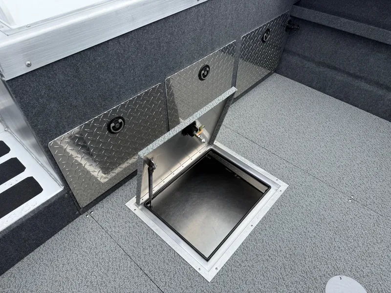 Slide: The Image of 2025 Thunder Jet 210 Luxor boat interior with open storage compartment. - 11