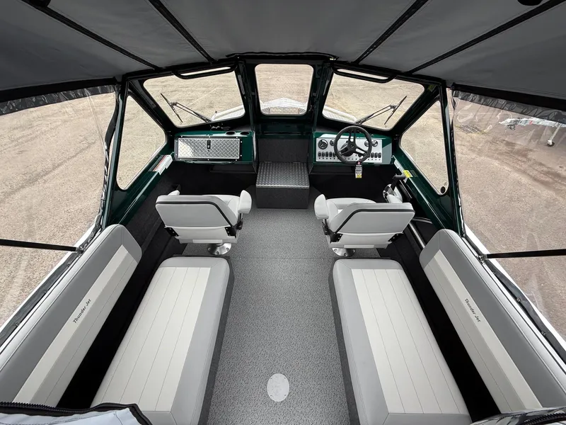 Slide: The Image of Interior of 2025 Thunder Jet 210 Luxor boat, featuring modern seating and dashboard. - 12