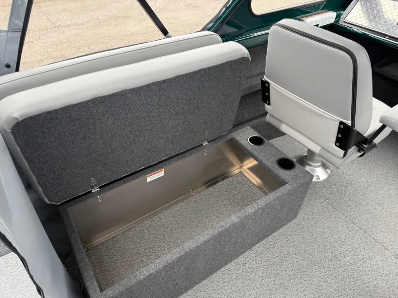 Slide: The Image of Interior of 2025 Thunder Jet 210 Luxor boat with open storage compartment and seating. - 14