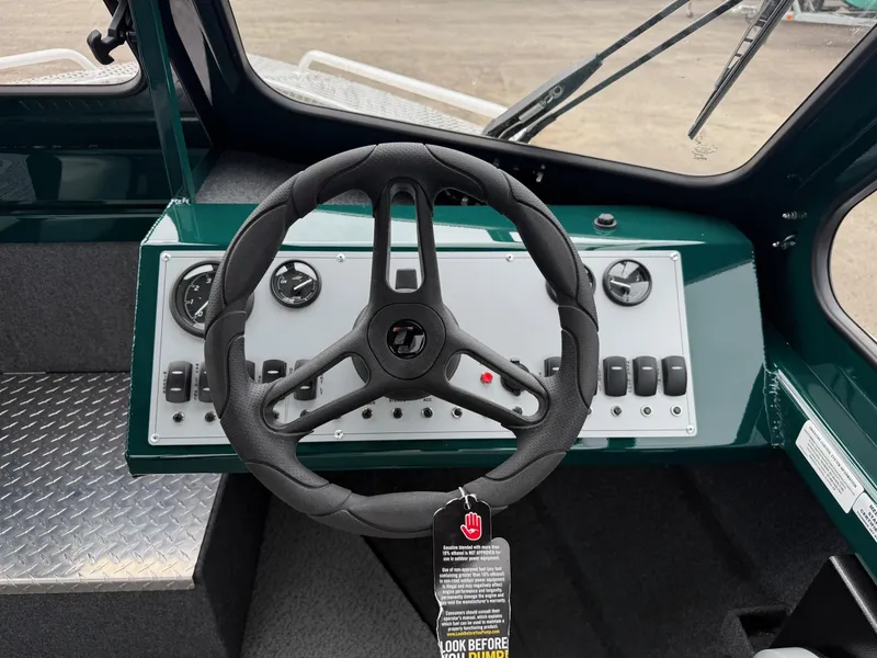 Slide: The Image of 2025 Thunder Jet 210 Luxor dashboard with steering wheel and control panel. - 16