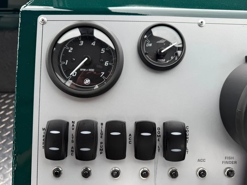 Slide: The Image of Control panel of 2025 Thunder Jet 210 Luxor boat with gauges and switches. - 17
