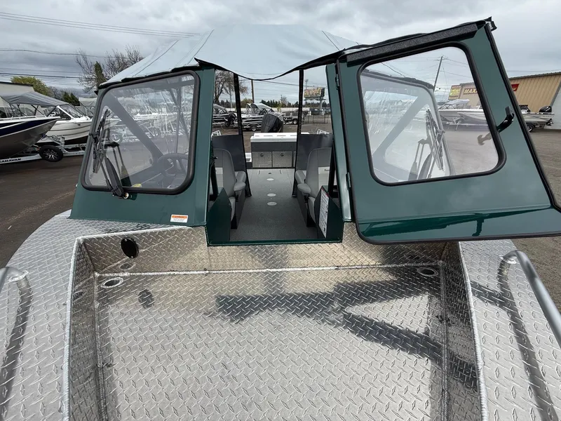 Slide: The Image of 2025 Thunder Jet 210 Luxor boat with open cabin and diamond plate deck. - 22