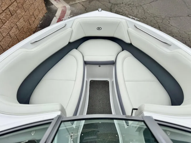 Slide: The Image of 2020 Cobalt 220S boat interior with white and gray seating, viewed from above. - 12
