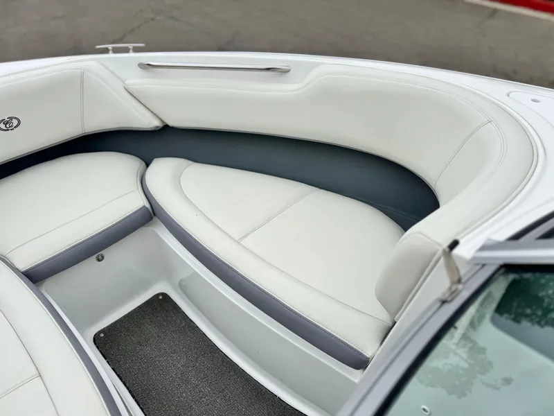 Slide: The Image of 2020 Cobalt 220S boat interior with white cushioned seating and sleek design. - 14