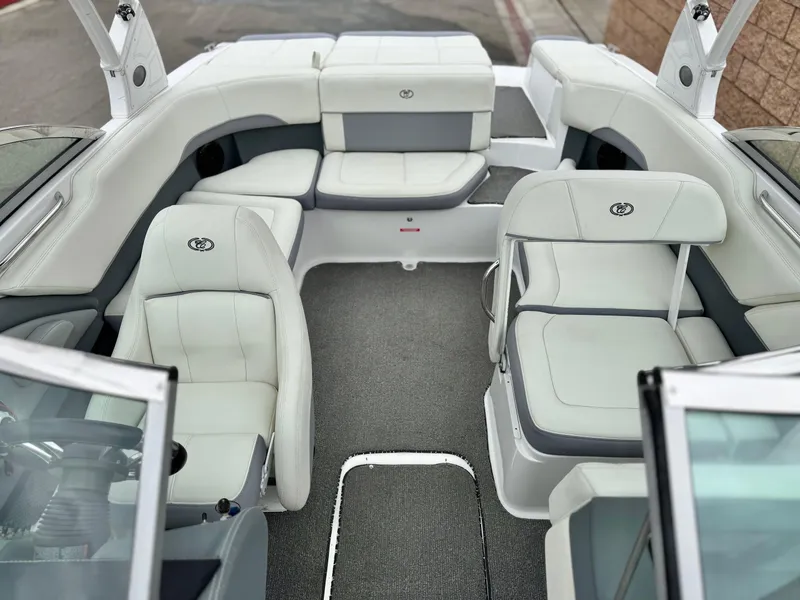 Slide: The Image of 2020 Cobalt 220S boat interior with white and gray seating, spacious layout. - 16