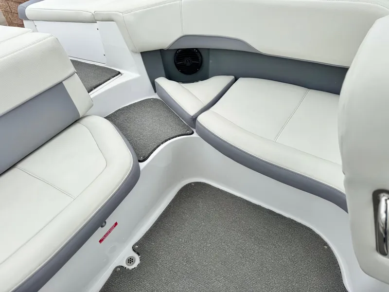 Slide: The Image of Interior seating of a 2020 Cobalt 220S boat with gray and white upholstery. - 19