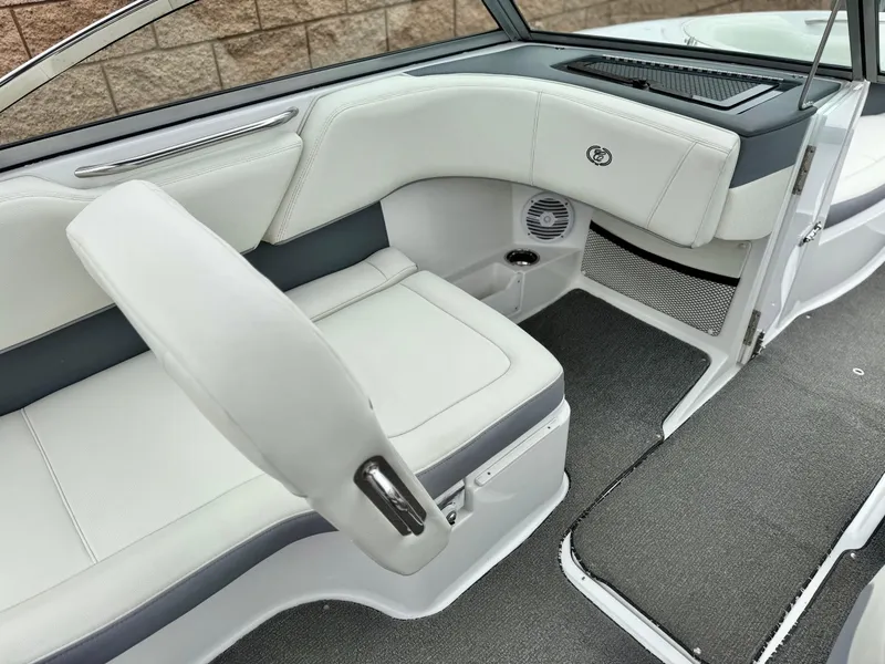 Slide: The Image of 2020 Cobalt 220S boat interior with white seating and modern design. - 23