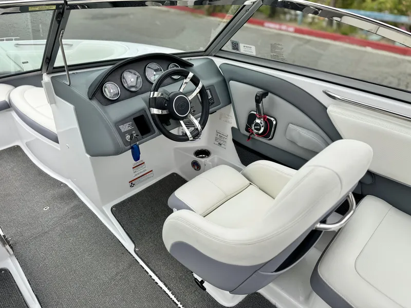 Slide: The Image of 2020 Cobalt 220S boat interior with steering wheel and dashboard controls. - 26