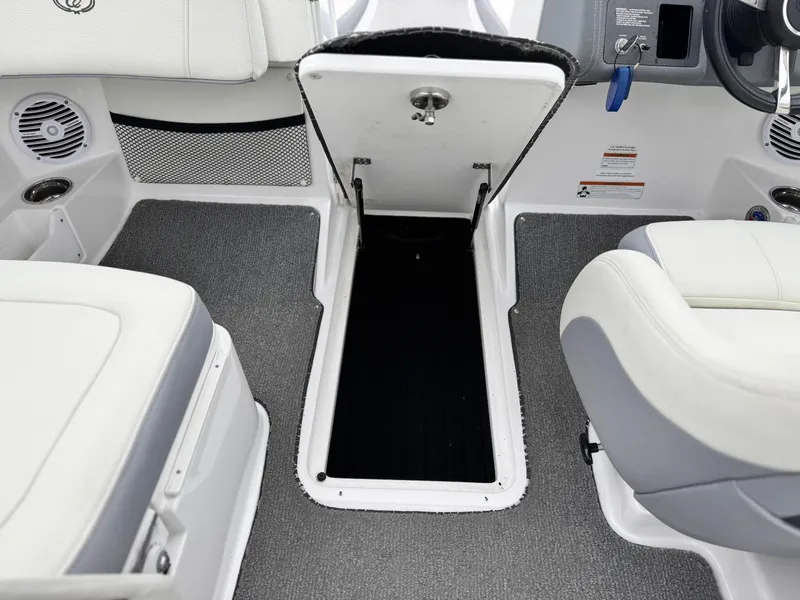 Slide: The Image of 2020 Cobalt 220S boat interior with open storage compartment and seating. - 30