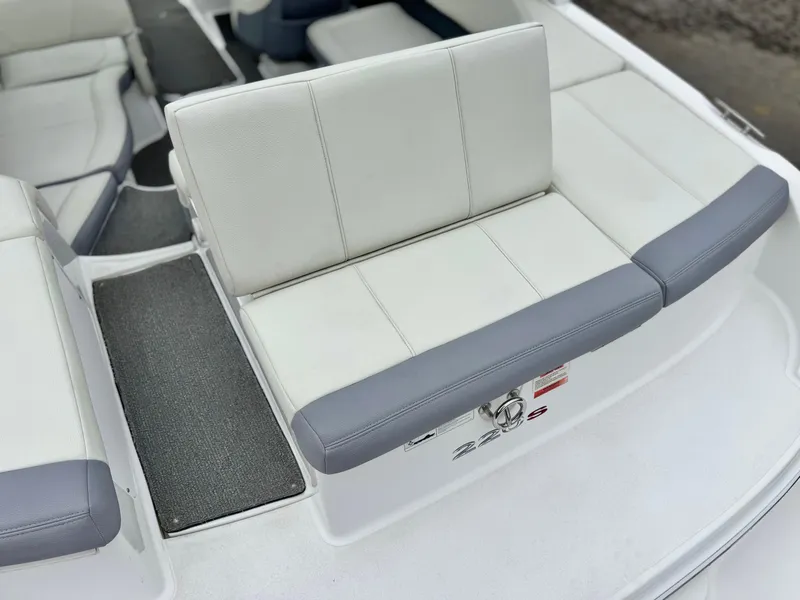 Slide: The Image of 2020 Cobalt 220S boat interior with white and gray seating. - 8