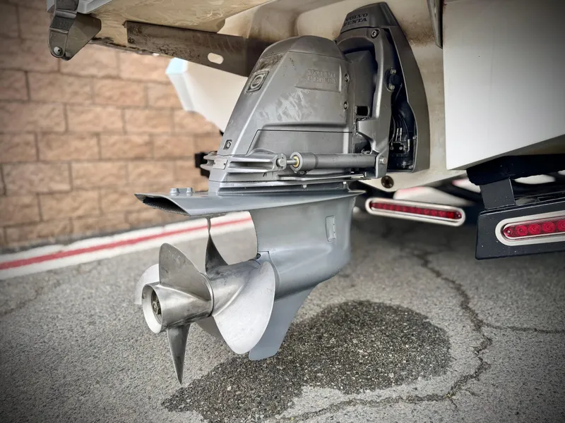 Slide: The Image of 2020 Cobalt 220S boat propeller and outdrive, close-up view. - 9