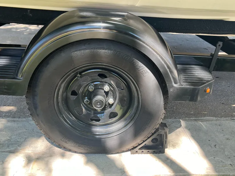 Slide: The Image of Trailer wheel of a 2007 Sea-Doo GTI 130, secured with a wheel chock. - 4