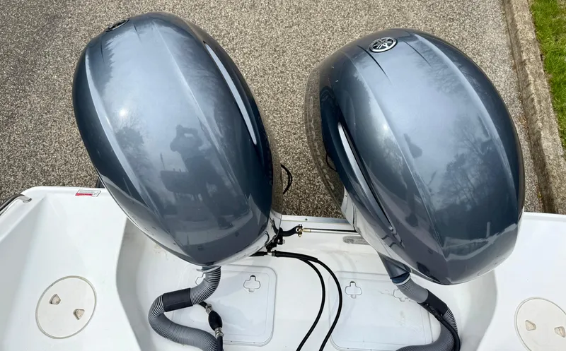 Slide: The Image of Twin outboard motors on a 2019 Sea Hunt Gamefish 25 boat. - 3
