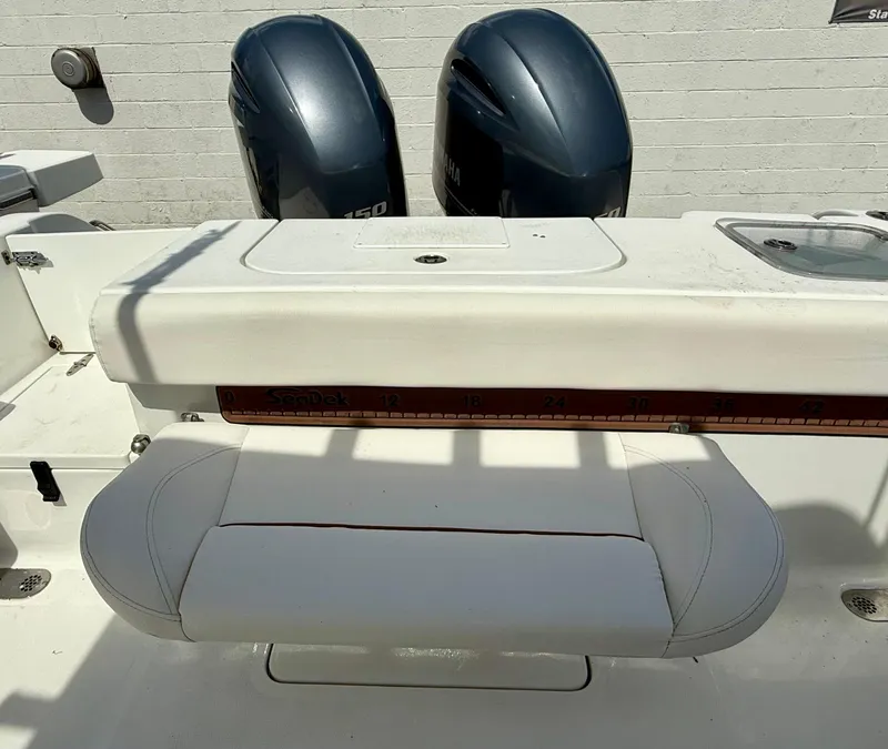 Slide: The Image of 2019 Sea Hunt Gamefish 25 boat with dual engines and cushioned seating. - 35