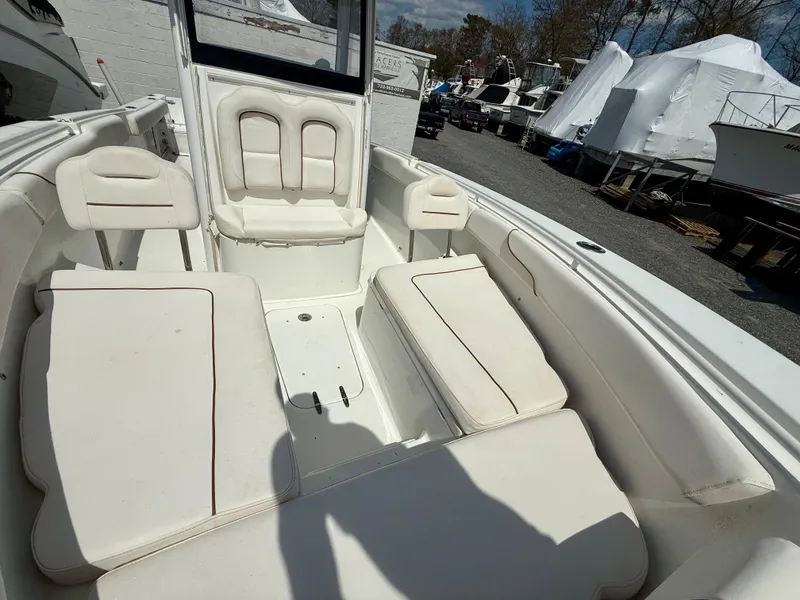 Slide: The Image of 2019 Sea Hunt Gamefish 25 boat interior with white cushioned seating. - 41