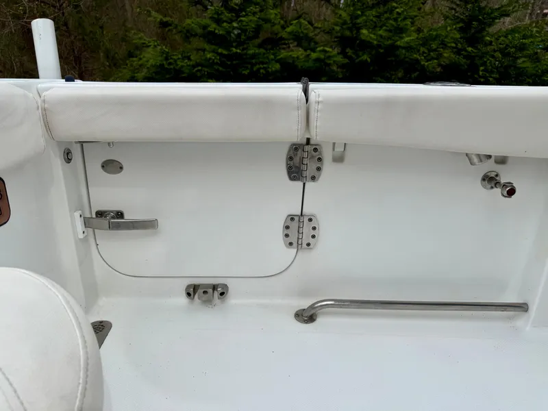 Slide: The Image of 2019 Sea Hunt Gamefish 25 boat interior with white seating and stainless steel fittings. - 8