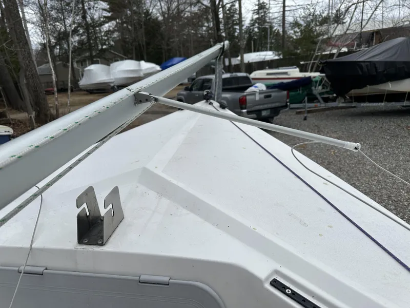 Slide: The Image of Sailboat deck with rigging, Precision 15 model, 2012, in a boatyard setting. - 4