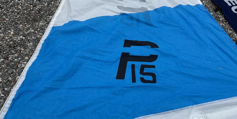 Slide: The Image of Blue and white sail with "P 15" logo, Precision model 15, 2012. - 7