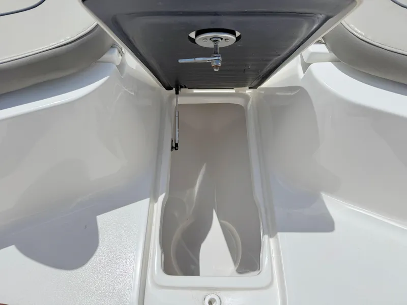 Slide: The Image of 2023 Key West 239 FS boat storage compartment with open hatch. - 11
