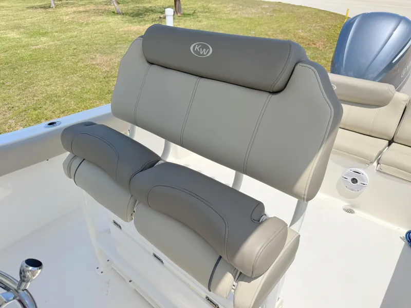 Slide: The Image of 2023 Key West 239 FS boat seating with gray cushions and logo. - 14