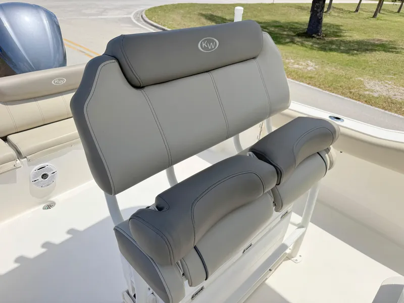 Slide: The Image of 2023 Key West 239 FS boat with gray cushioned seating and sleek design. - 15