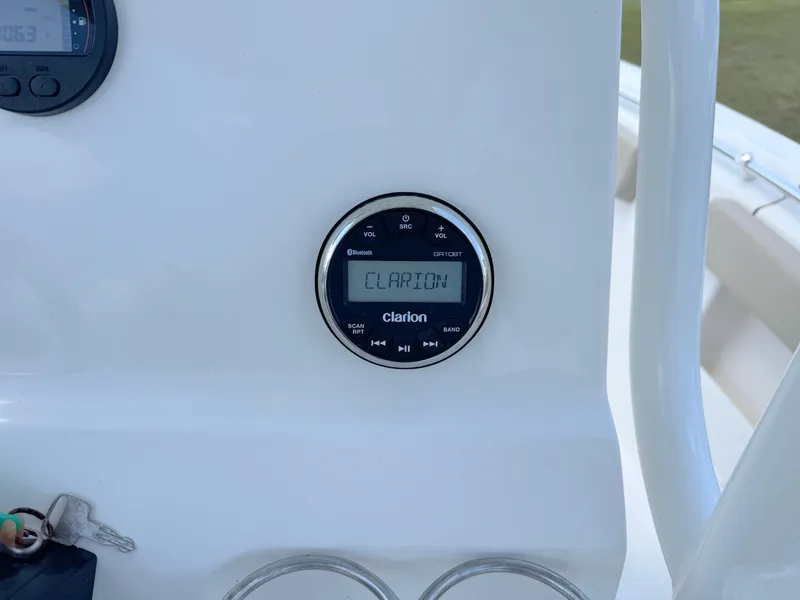 Slide: The Image of Clarion audio system on 2023 Key West 239 FS boat dashboard. - 19
