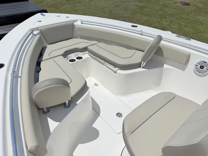 Slide: The Image of 2023 Key West 239 FS boat interior with beige seating and cup holders. - 8