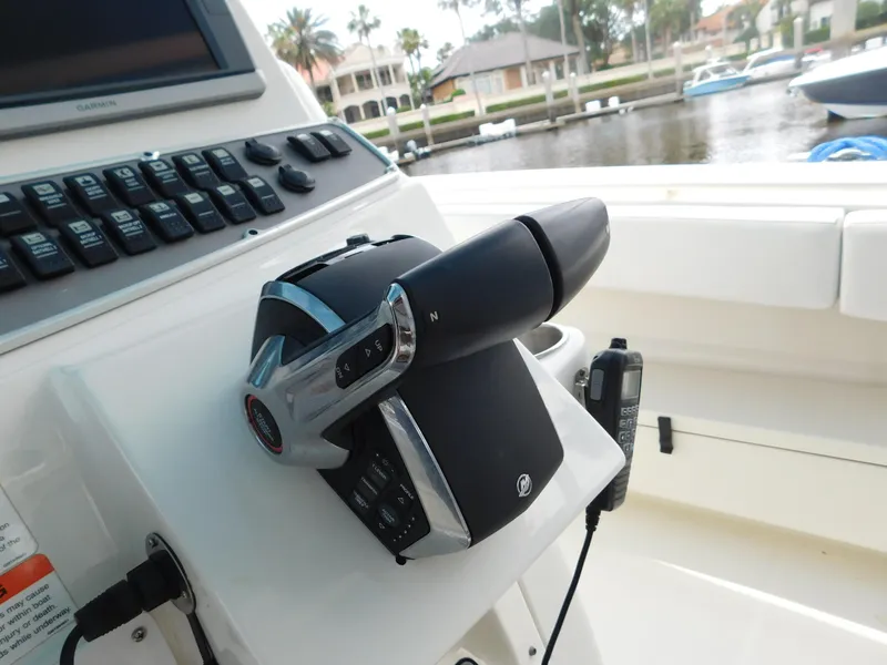 Slide: The Image of Control panel of a 2013 Hydra-Sports 4200 Siesta boat, docked near waterfront homes. - 40