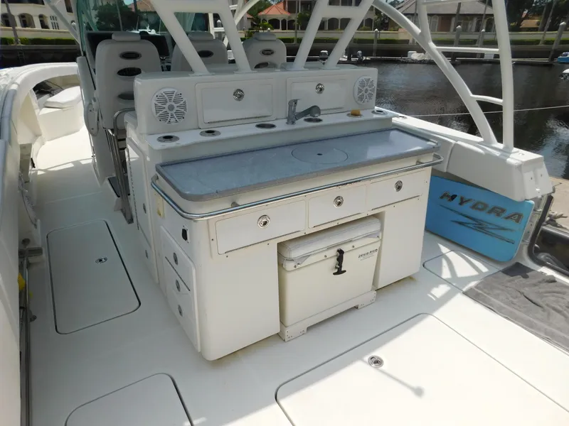 Slide: The Image of 2013 Hydra-Sports 4200 Siesta boat interior with seating and storage. - 49