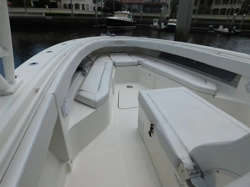 Slide: The Image of 2013 Hydra-Sports 4200 Siesta boat interior with white seating and storage compartments. - 7