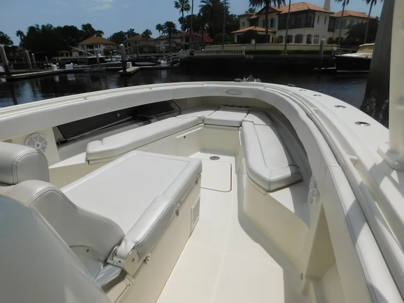 Slide: The Image of 2013 Hydra-Sports 4200 Siesta boat with spacious seating, docked in a marina. - 8