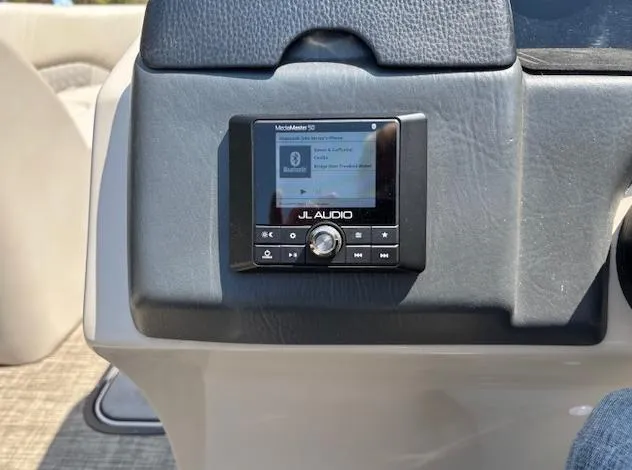 Slide: The Image of 2019 Harris Solstice 220 boat dashboard with JL Audio system display. - 11