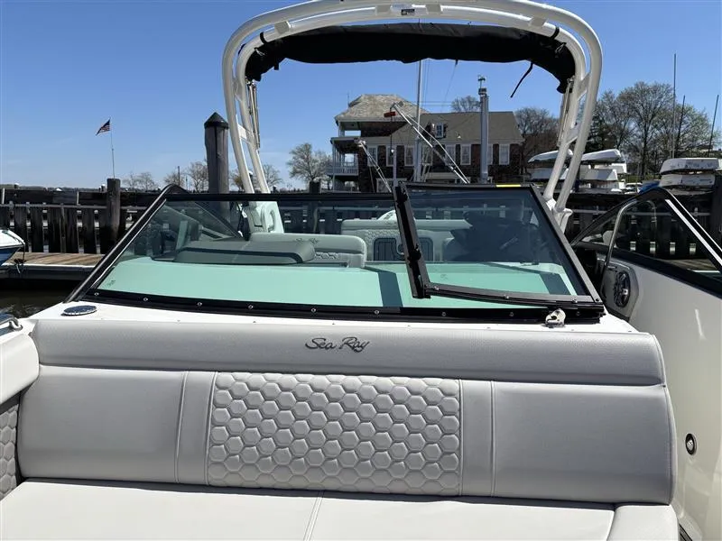 Slide: The Image of 2025 Sea Ray SDX 250 boat with sleek design, docked at marina. - 4