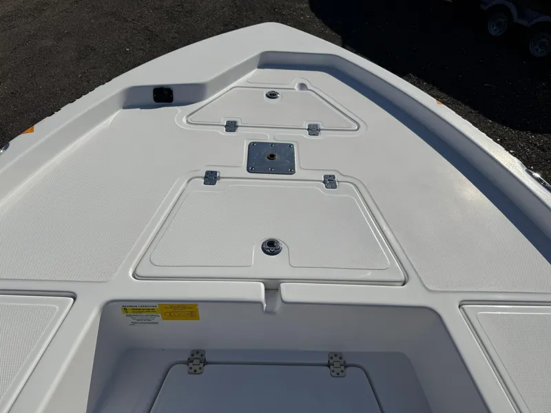 Slide: The Image of 2025 NauticStar 214 Shallow Bay boat deck with storage compartments. - 11
