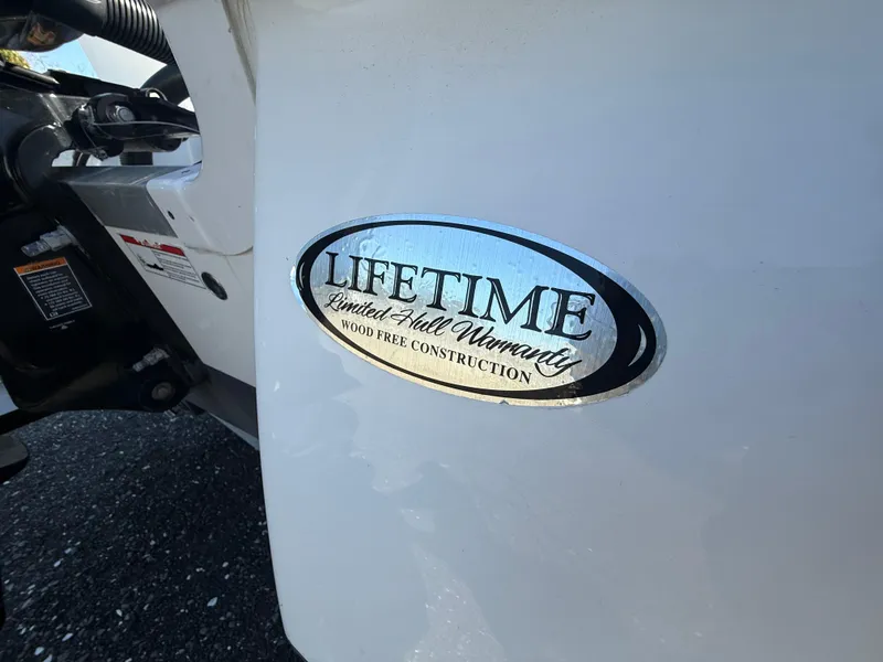 Slide: The Image of 2025 NauticStar 214 Shallow Bay boat with lifetime hull warranty badge. - 20